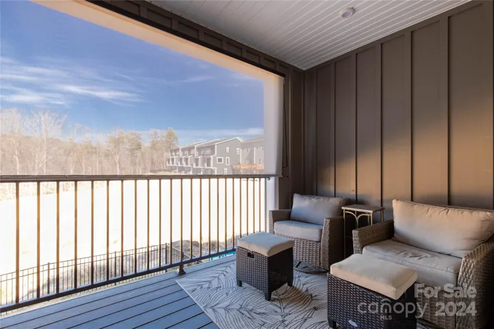 Covered back porch overlooking Pond
