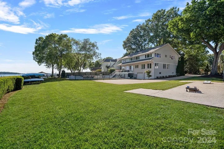 A wide open backyard space leads to the dock where you can get on your boat, or take a kayak/paddle board out into the cove!