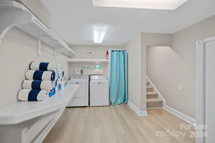 Basement area complete with laundry and storage