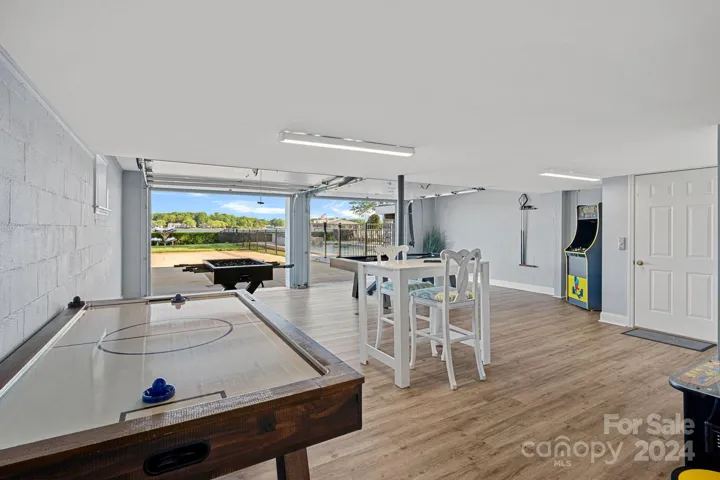 Game room/garage opens up to the backyard and the lake!