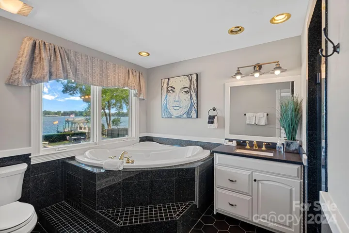 First Primary Suite bathroom with lake views