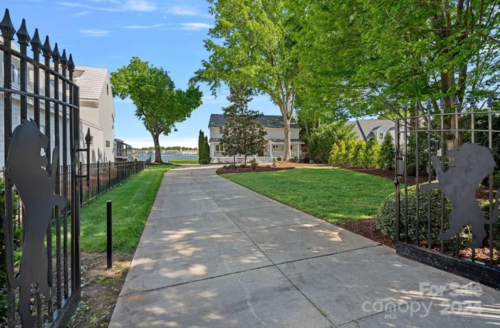 Gated entry to this waterfront oasis