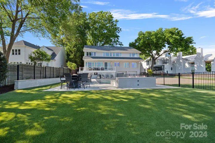 Turf in the fenced backyard makes for seamless yard maintenance!
