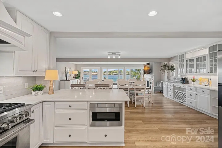 Entertaining is a dream, with this open kitchen into the living room, with beautiful lake views!