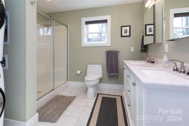 Bathroom with washer and dryer in ADU