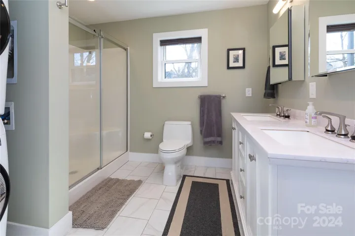 Bathroom with washer and dryer in ADU