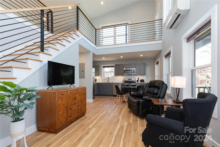 Living room in ADU facing kitchen and dining area