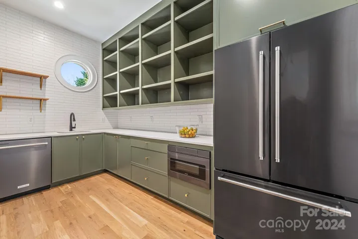 Working pantry: second refrigerator, second dishwasher, microwave drawer and custom cabinetry