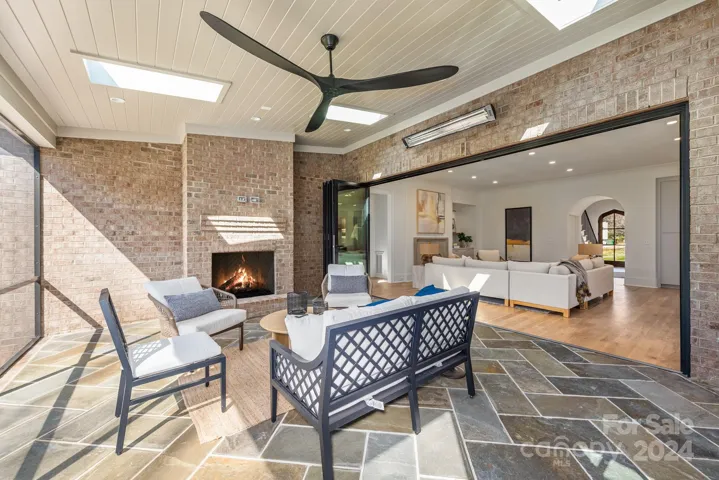 Screened porch with accordian folding doors extends the living space