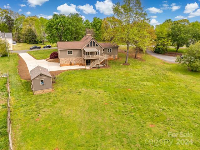 Arial view of the home-the shed/workshop is wired with 50 amp service, insulated and window hvac works.