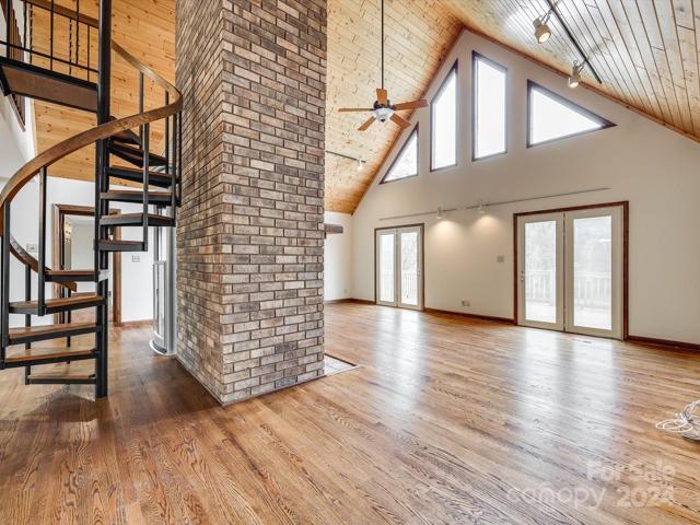 Open floor plan, with a wood-burning fireplace.