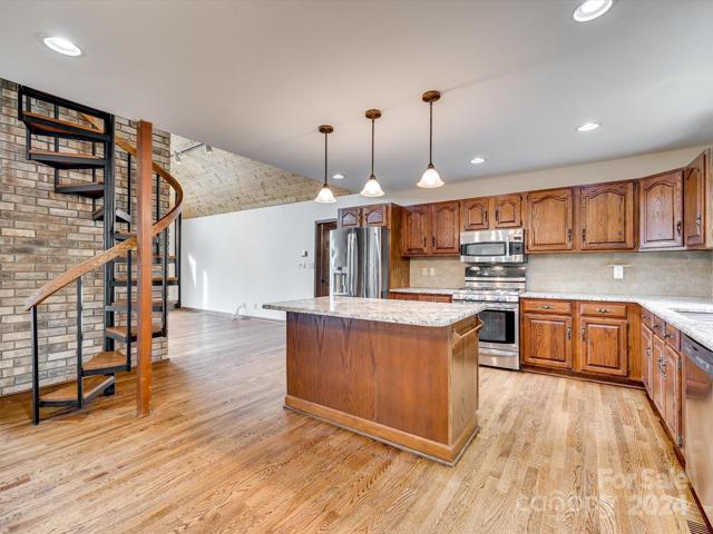 View from the dining area. Spiral staircase leads to the loft area which overlooks the gorgeous Chalet like Great Room!