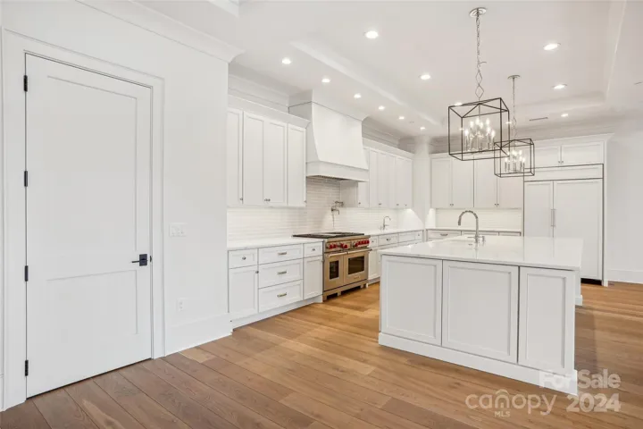 Luxury Entertainment Kitchen with Wolfe and SubZero Appliances in Open Kitchen, Living and Dining Area with a large pantry