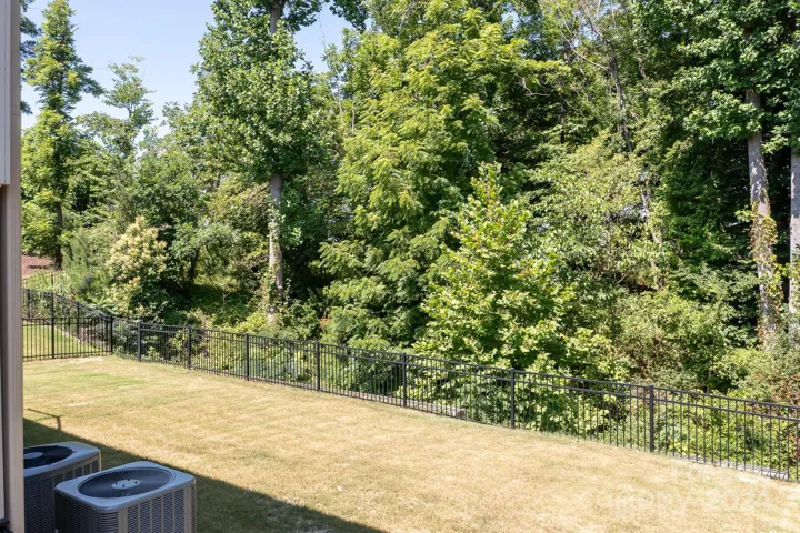 Such a beautiful and lush backyard with the treelined property.