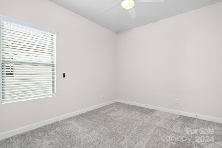 Bedroom 3 on main level with walk in closet.