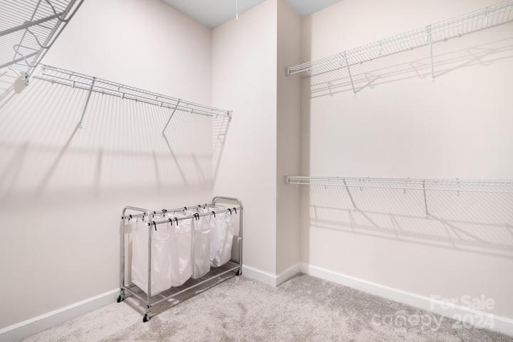 Primary walk in closet.
