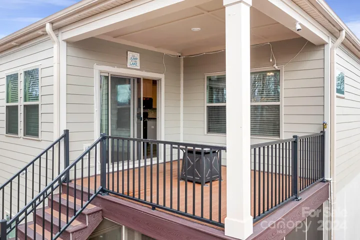Main level deck/balcony with TREX steps leading into your backyard.