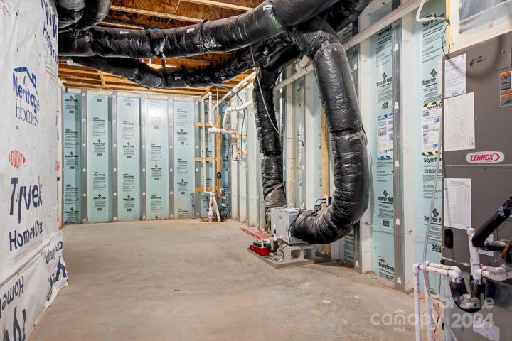 HUGE storage room to the left as you come down the steps and enter the basement