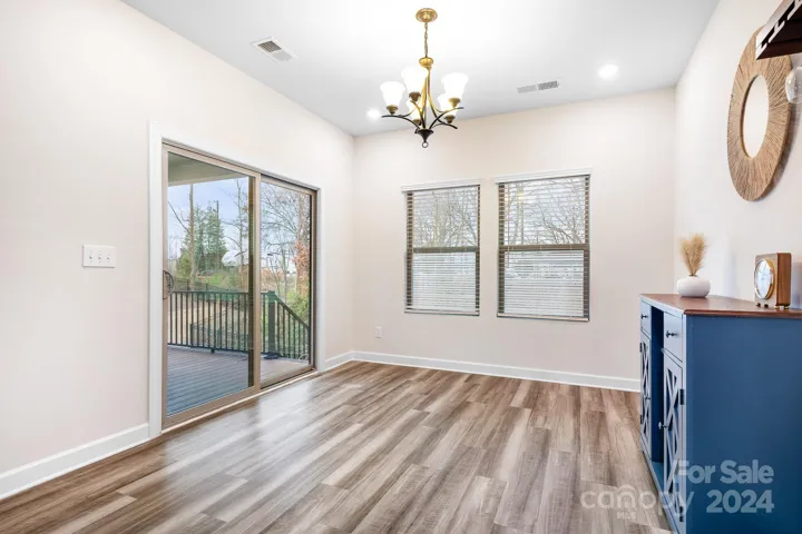 Dining area with access to your beautiful deck/backyard. No need to go down through the basement to access.