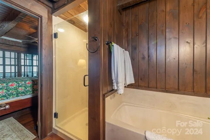 Primary bath features cultured marble garden tub and walk-in shower