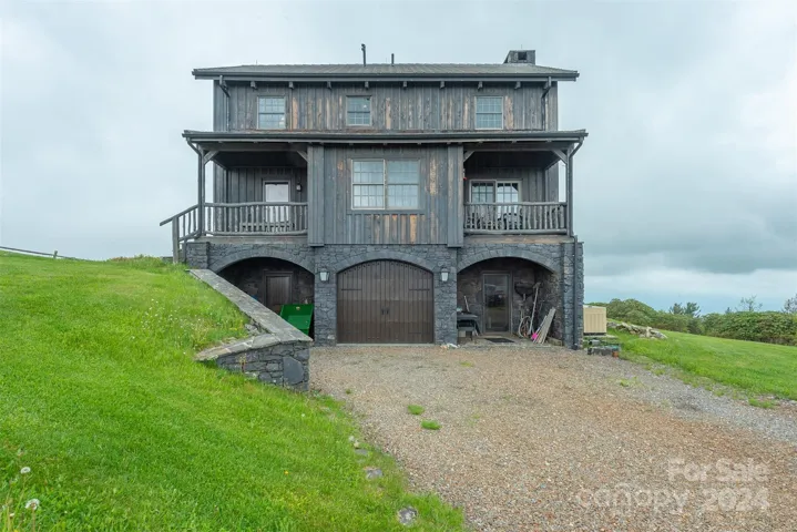 Majestic rear of home faces Mount Mitchell