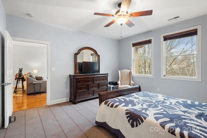 Primary bedroom leading to living room area