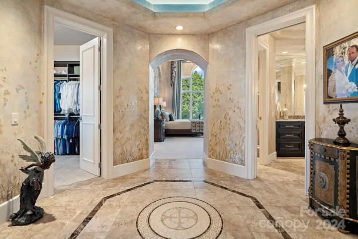 Foyer to primary suite, tile insert was custom designed and created in Itlay