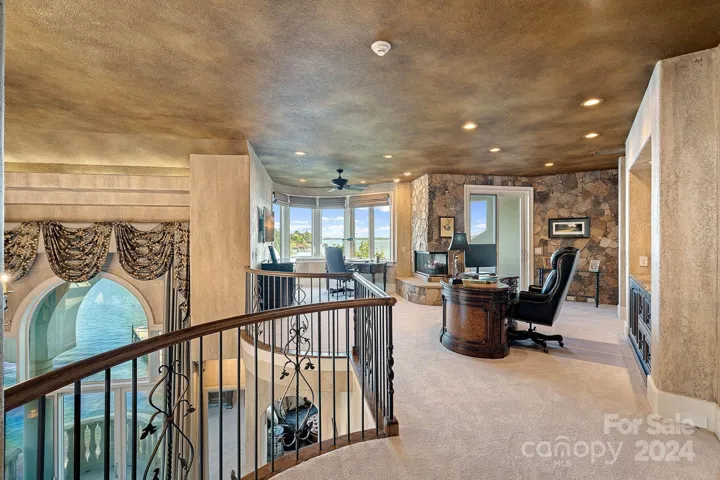 2 story primary suite with upper level office, complete with powder room and elevator access