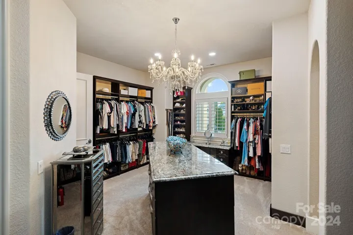 New primary walk-in closet with built in makeup table