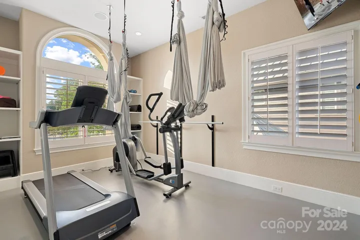 Primary suite exercise room complete with ballet barre