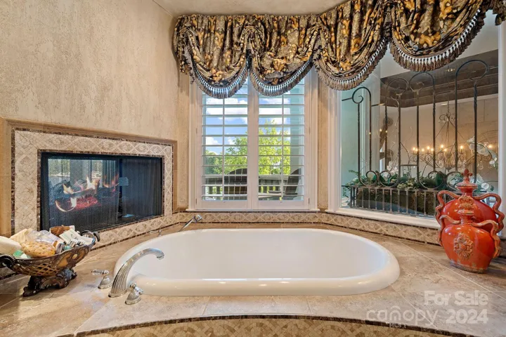 See through fireplace from sitting room over garden tub
