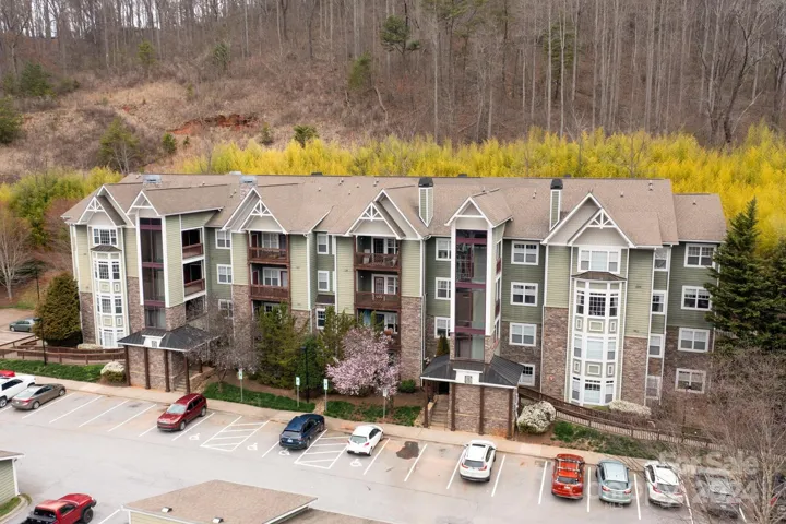 Perched At the Top of Eastwood Village Offering Mountain and Wooded Views