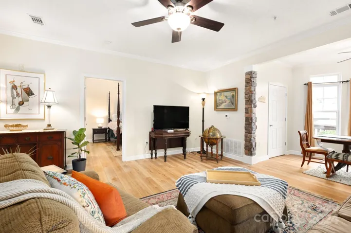 Living Room Flows to Sunroom/Dining Area