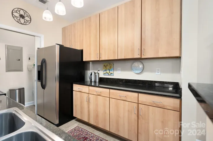 Kitchen Features Granite, Stainless Steel, and Ample Cabinet/Counter Space
