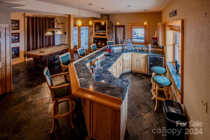 Lower level full bar w/  granite top, sink, wine refrigerator