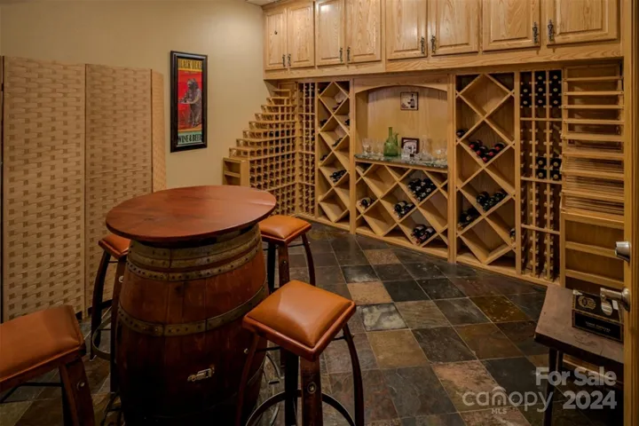 Intimate wine cellar and tasting room in lower level