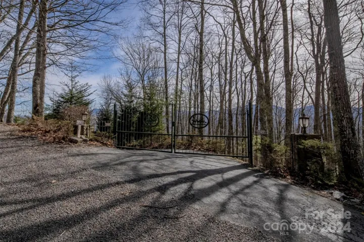 Metal gates at top of driveway for added privacy