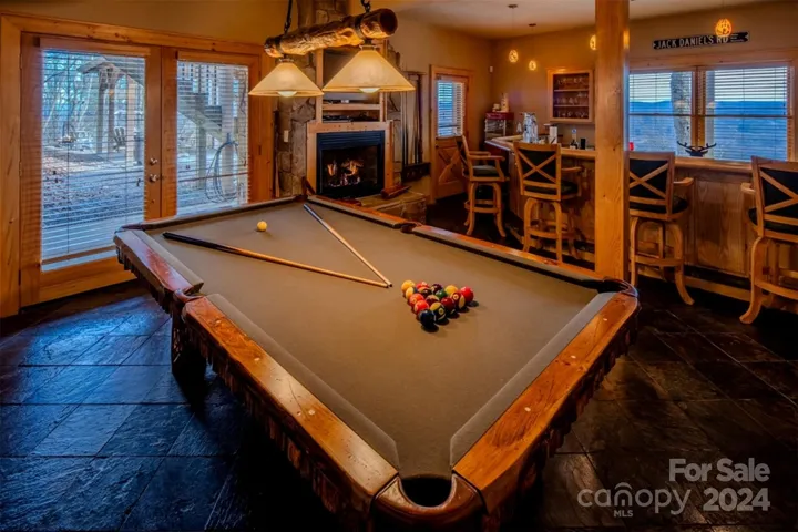 Custom pool table beside bar