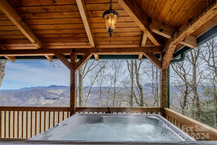 8-person hot tub on covered deck overlooking view