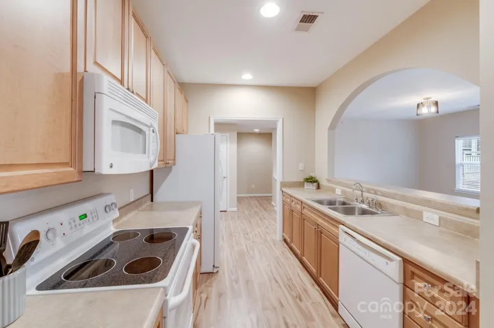 Kitchen has cut out to living and dining