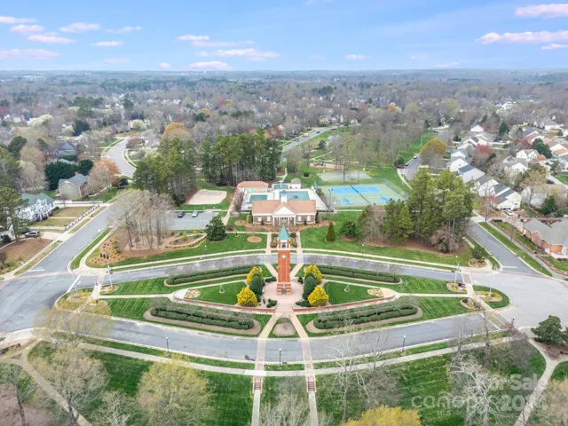 Clock Tower overlooking clubhouse, pool, and courts