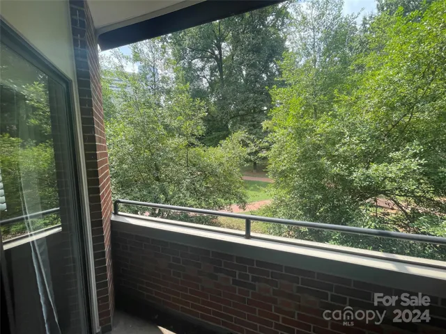 The view over Settlers Park in Spring from the 2nd balcony belonging to Unit 9.  Enjoy the privacy that the holly trees provide while enjoying a morning up coffee.