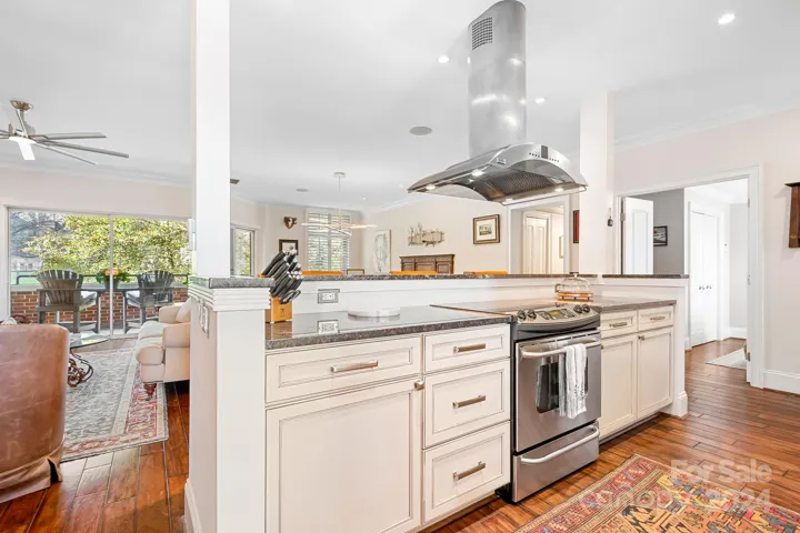 The kitchen bar design allows one to be a part of the party but hide some of the mess.