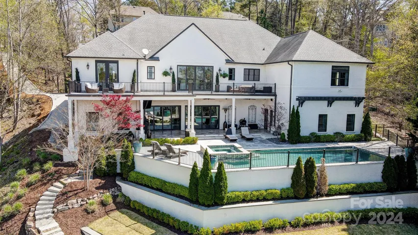 Relax in the lakeside pool, lounge on the covered porch or terrace overlooking the lake & enjoy boating or water sports from your dock