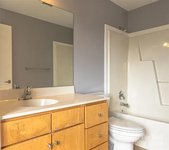 Primary bathroom has garden tub and shower and more storage space under the cabinets