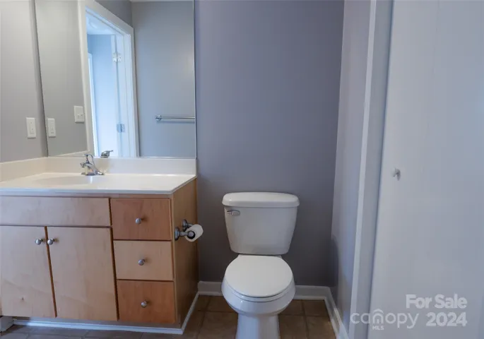 2nd Full Bathroom in the hallway beside the bedroom with stand alone shower and storage space under the cabinets