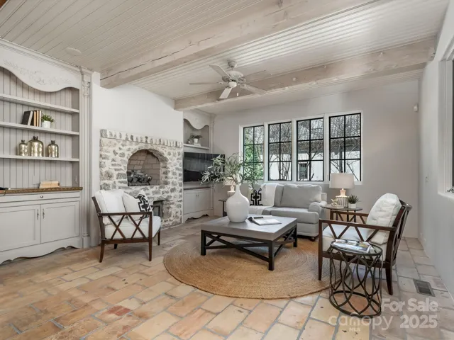 Gathering room/den off the kitchen with build in gas logs and tv for family gatherings