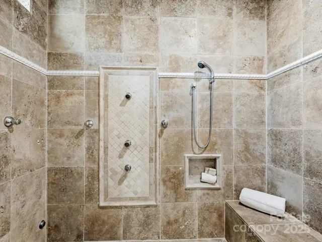enclosed steam shower w recliner and multiple shower heads