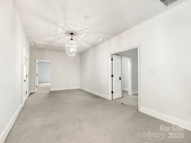 sitting area off 3rd BR and entrance to the apartment.  Upper level