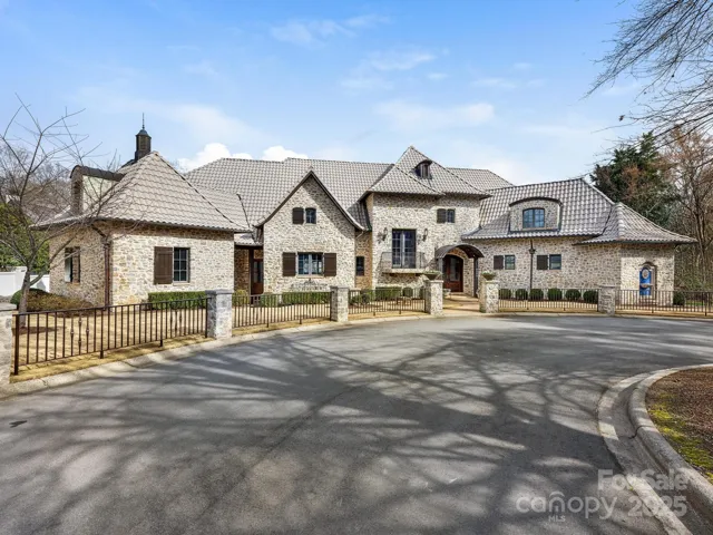 Updated exterior on this solid rock home with tile roof and custom railings and copper gutters